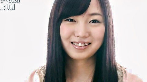 Cute smiling Asian babe with long black hair and bangs in shiny gold top