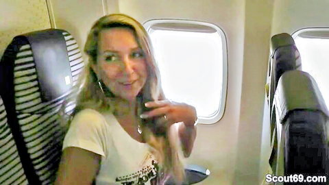 Blonde German MILF Scout 69 selfie on airplane in white tank top