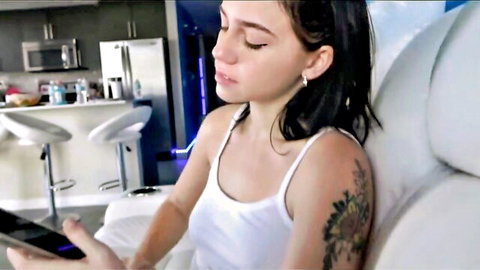 18yo Remi in white tank top, black hair, sunflower tattoo on arm