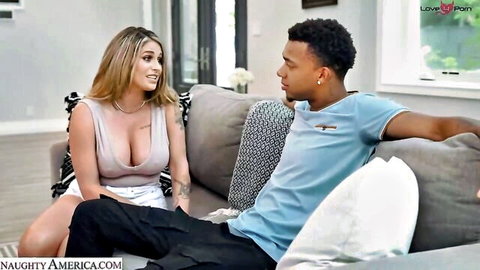Blonde big tits housewife in cleavage-baring top flirts with black stud on living room couch