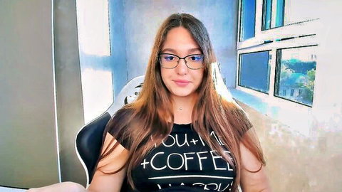 Brunette webcam girl with glasses smiling in 'YOU + COFFEE = HAPPY' t-shirt solo tease