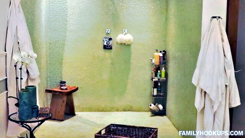 Luxurious spa bathroom interior with white robes, orchids, and amenities ready for MILF fuck session