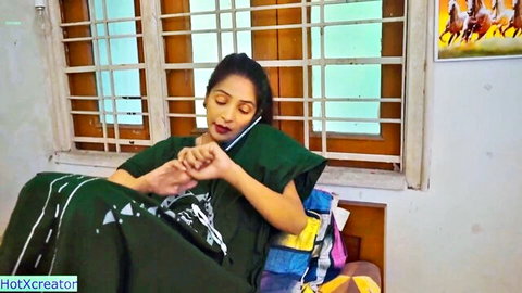 Innocent Desi teen in green salwar kameez on phone before massage