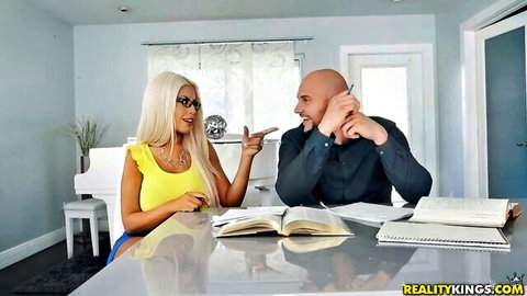 Blonde babe with glasses in yellow top gesturing at bald guy during steamy desk chat