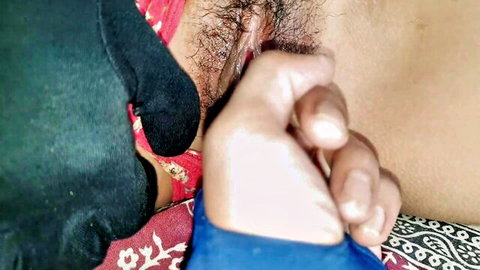Close-up of hairy Indian pussy being fingered and spread by hand in homemade sex