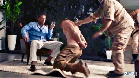 Handcuffed muscular man kneels pants-down as uniformed hunks dominate him in rough gay scene