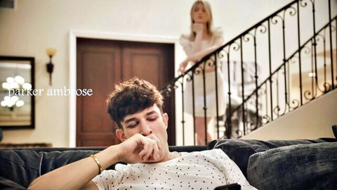 Melody Marks in white dress watches Parker Ambose on couch, virginity tension
