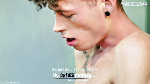 Curly-haired twink with neck tattoo moans in ecstasy eyes closed mouth open tongue out shirtless