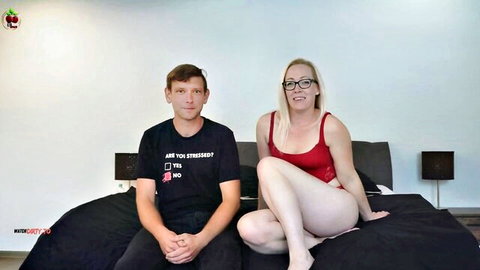 Lea Kirsch and Manuel teasing on bed in red lingerie