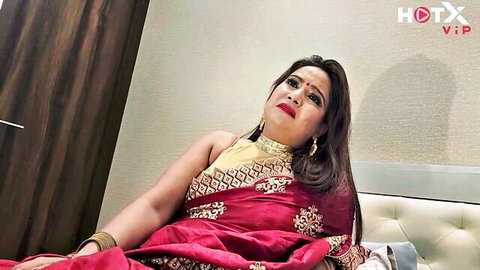 Roshnisexy as busty Indian stepmom in red saree, seductive pose