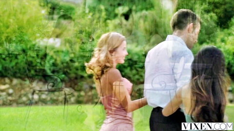 Blonde and brunette in sexy dresses tease with man in outdoor FFM threesome