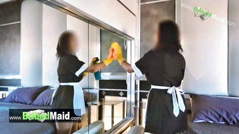 Sexy 18-year-old Latina maid in black uniform cleaning mirror