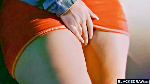 Curvy babe in orange mini skirt pulling up to tease big ass