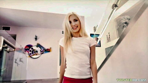 Blonde babe with small tits in tight white t-shirt and red shorts smiling teasingly