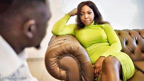 Samantha Cameroons ebony MILF in sexy green dress on couch