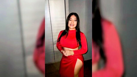 Sexy Latina babe in tight red slit dress, smiling seductively