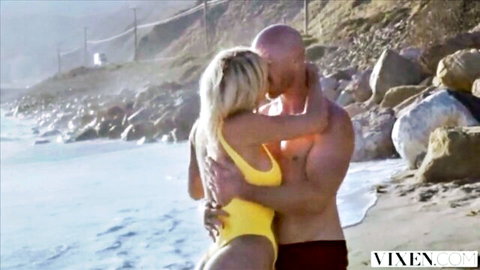 Natalia Starr in yellow bikini hugs bald stud on rocky beach