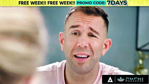 Excited man in pink shirt smiling for nuru massager free week promo code 7days