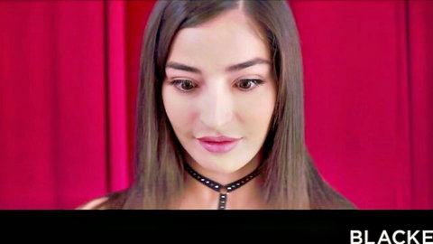 Seductive brunette babe with spiked choker pouts teasingly for BBC action
