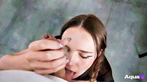 Petite brunette with braids in intense oral sex closeup