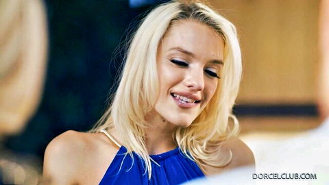Blonde Kenna James in sexy blue dress smiles seductively with Emma Hix