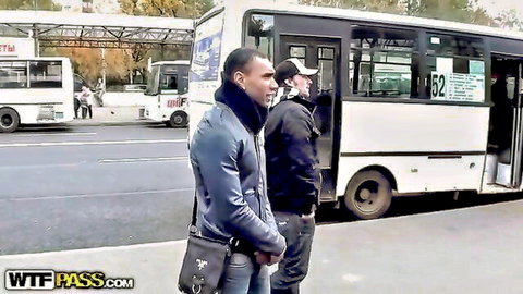 Two men in leather jacket and hoodie at bus stop, pickup for public blowjob