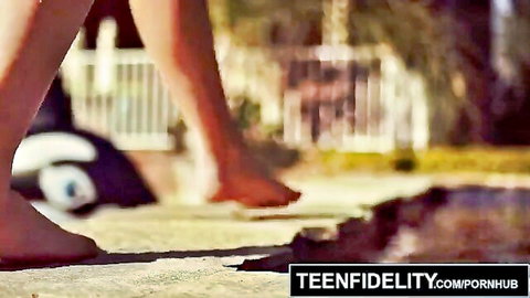 Bailey Brooke's bare legs and feet tease poolside in outdoor scene