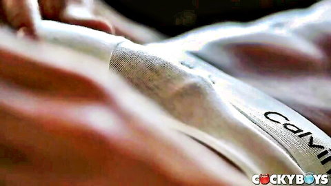 Justin Matthews pulls down Nico Leon's Calvin Klein briefs exposing uncut cock