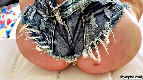 Slimthick Vic teasing in ripped denim shorts, showcasing her big curvy ass
