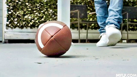 Hot Ass Hollywood in jeans and sneakers with football, teasing athlete creampie vibe