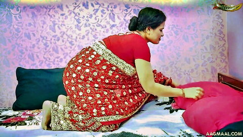 Curvy Indian stepmom in red saree bends over showing massive ass