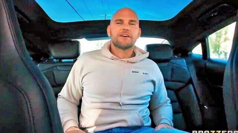 JMac in hoodie inside luxury car for Angela White steamy Brazzers scene