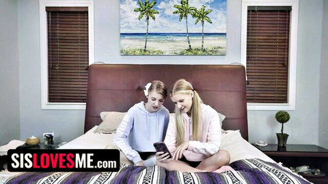 Two blonde teen stepsisters in hoodies sitting on bed checking phone taboo foreplay