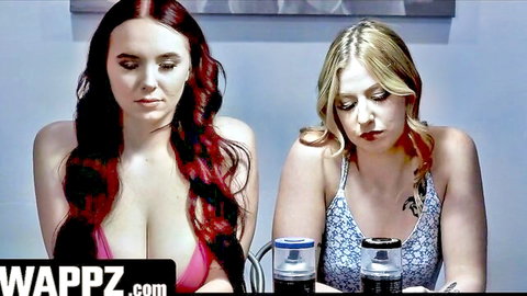 Busty redhead and blonde in low-cut dresses at cop confession table with Juan Largo