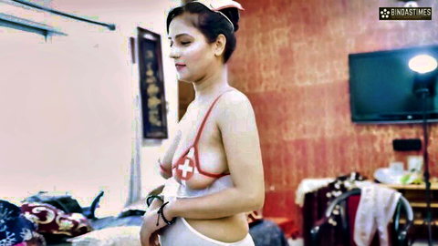 Seductive Indian nurse in skimpy red cross bra and panties