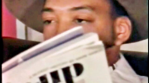 Vintage man peeks over newspaper in classic adult scene setup