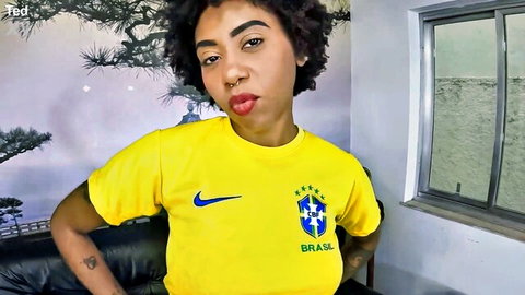 Ana Sasuga posing seductively in Brazilian soccer jersey