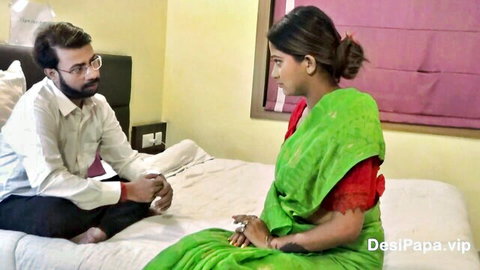 Young Indian woman in green sari interviewed by man on bed, Desi Papa amateur scene