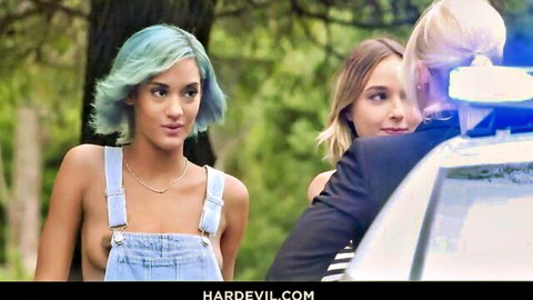 Tiffany Rousso in topless overalls and Sharon White in suit tease by police car with Maximo Garcia