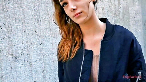Alice Zaffyre, redhead beauty in black bomber jacket, seductive pose