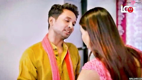 Indian housewife in pink top faces man in yellow kurta intimately close-up