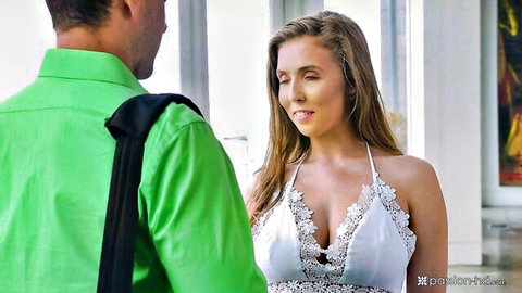 Lena Paul in low-cut white dress, close with man in green shirt