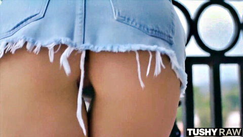 Parker Ambrose in fringed blue denim skirt, exposing tight ass