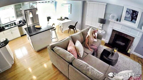 Blonde webcam nanny on phone in pink outfit, teasing fanboy dad