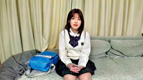 Mirai Sakino, 18, in sexy Japanese schoolgirl uniform, sitting pose