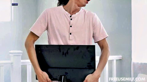 Richelle Ryan in pink top holding device in freeuse MILF scene