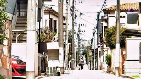 Rie Tachikawa in pink-hued Japanese alley street scene