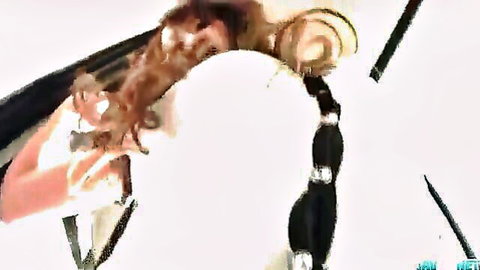 Rika Kurachi bent over with toys stretching both holes