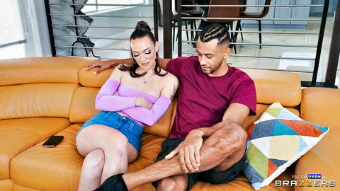 Cory Chase in pink top and shorts cuddles with muscular black stud