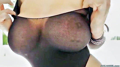 Alison Tyler in sheer black lingerie, exposing massive natural tits